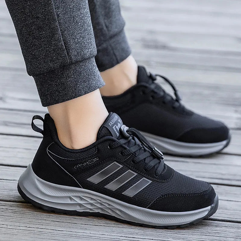 Breathable mesh casual shoes with elastic band closure in black, dark grey, purple and purplish red.