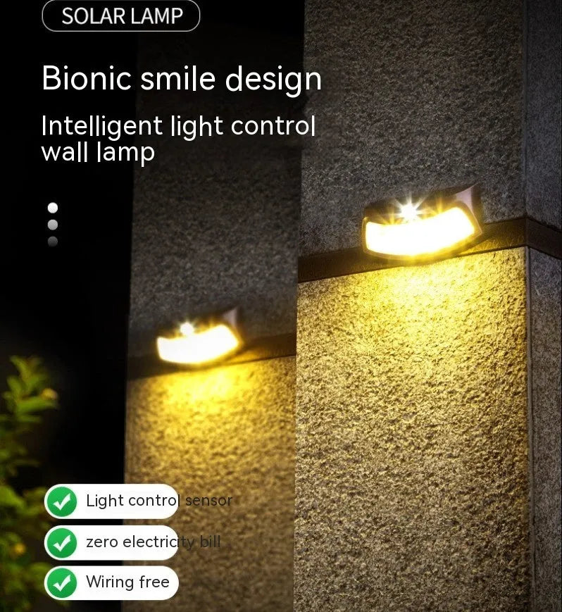 Solar garden wall light with smiley face design for outdoor courtyard illumination