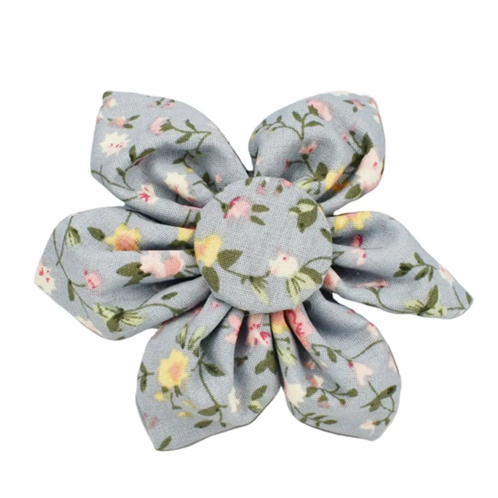 Blue floral pattern dog collar with matching leash, bow tie, vest and waste bag accessories on white background