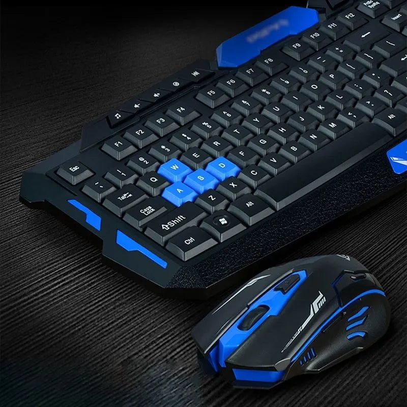 Black and blue wireless keyboard and mouse set on a desk showing ergonomic design.