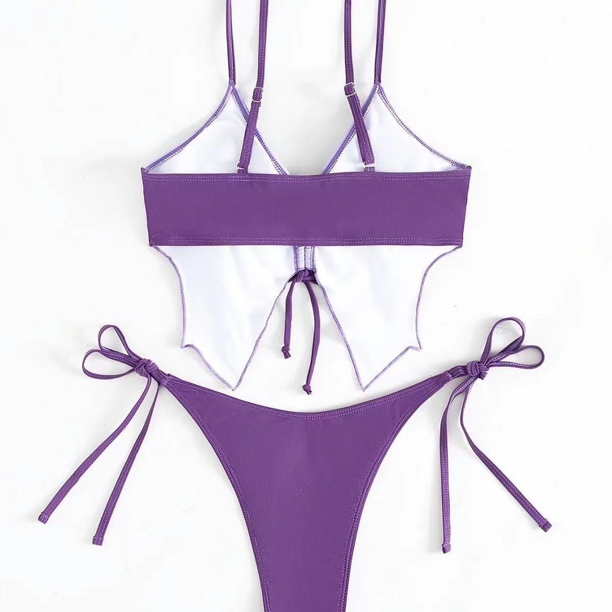 Women's purple bikini swimsuit with bow detail and split-style briefs on a mannequin.