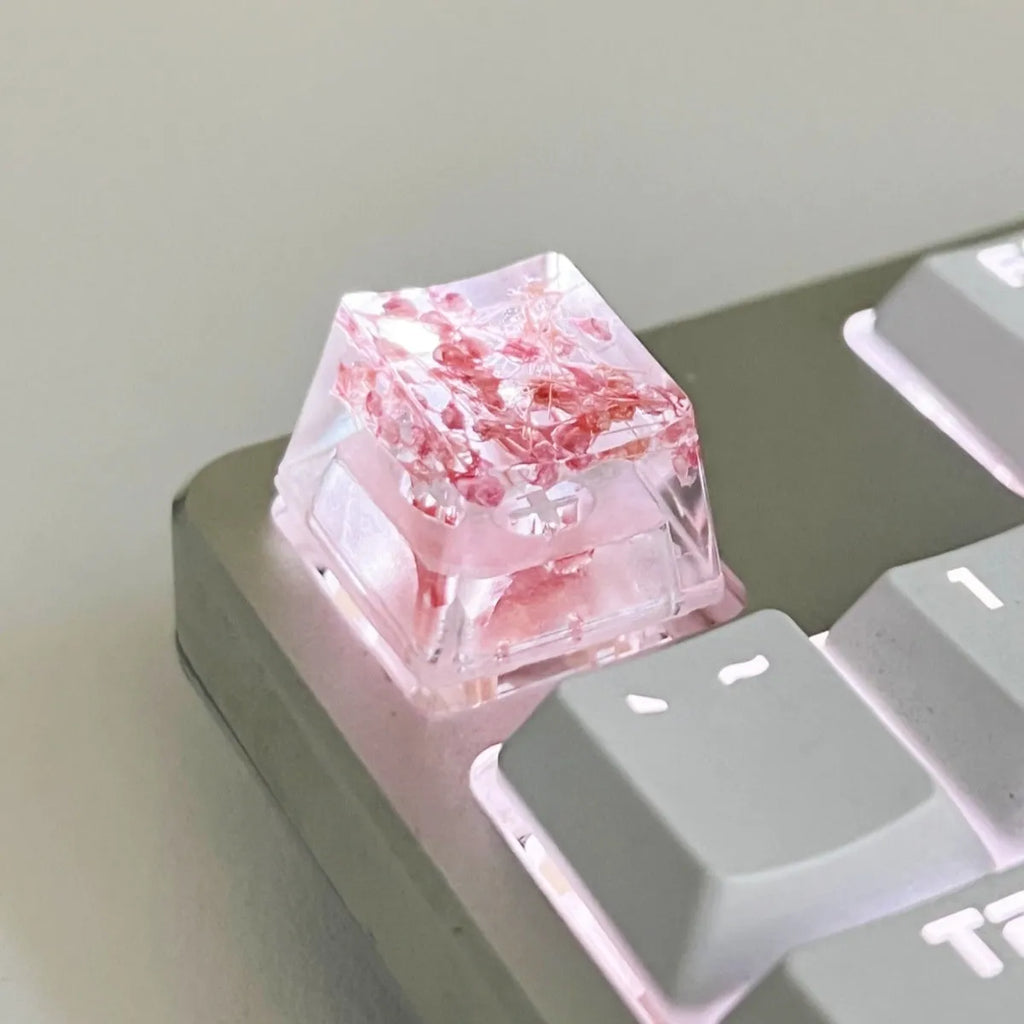 Transparent resin starry sky keycap for mechanical keyboards in green, measuring 1.8cm by 1.2cm.