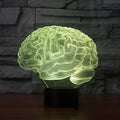 3D brain illusion LED desk lamp with acrylic design and remote control on wooden surface