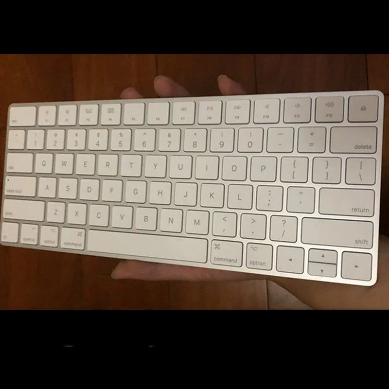 White Apple Bluetooth wireless keyboard with ultra-thin metal construction and multimedia keys