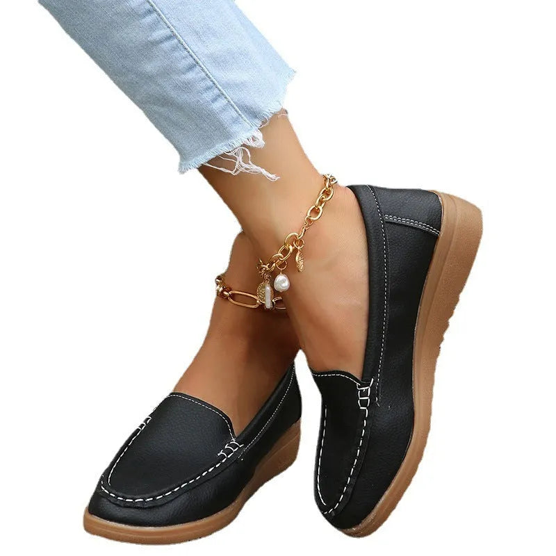 Women's flat loafer shoe in PU leather with a rubber sole, shown in a choice of colours.