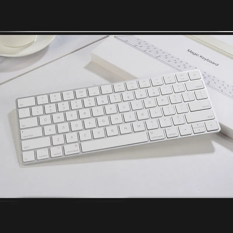 White Apple Bluetooth wireless keyboard with ultra-thin metal construction and multimedia keys