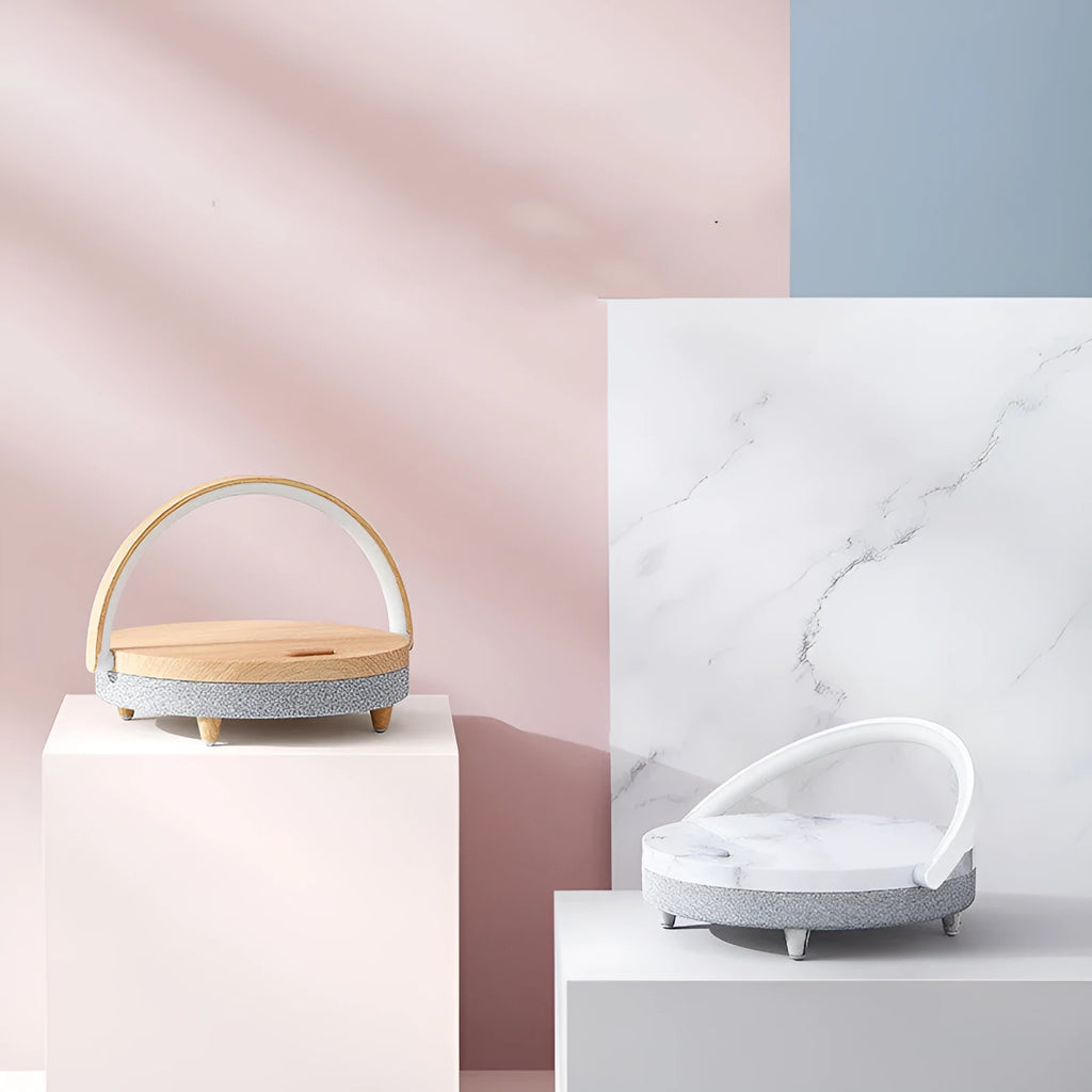Wireless charging LED night light with Bluetooth speaker in marble pattern finish showing phone holder