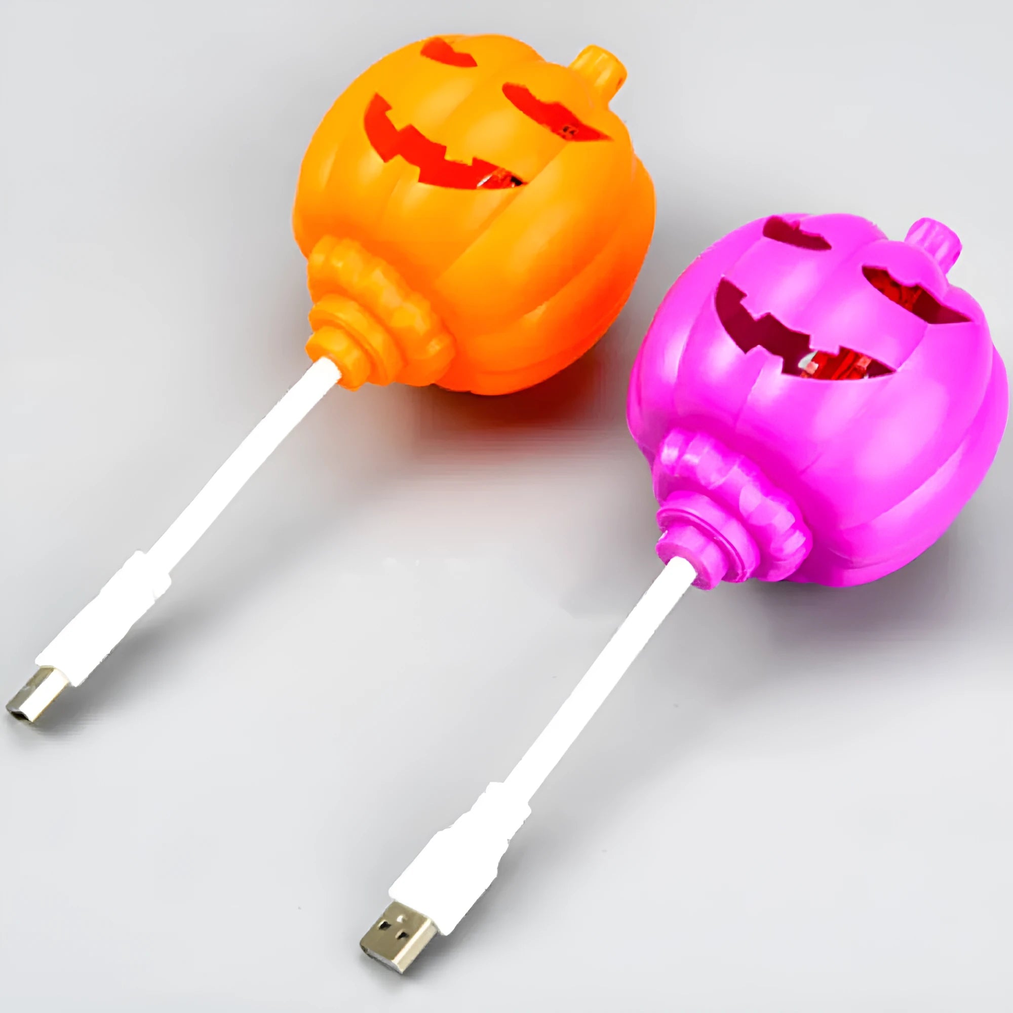 Plastic pumpkin lamp with USB charging port displaying yellow or purple light option