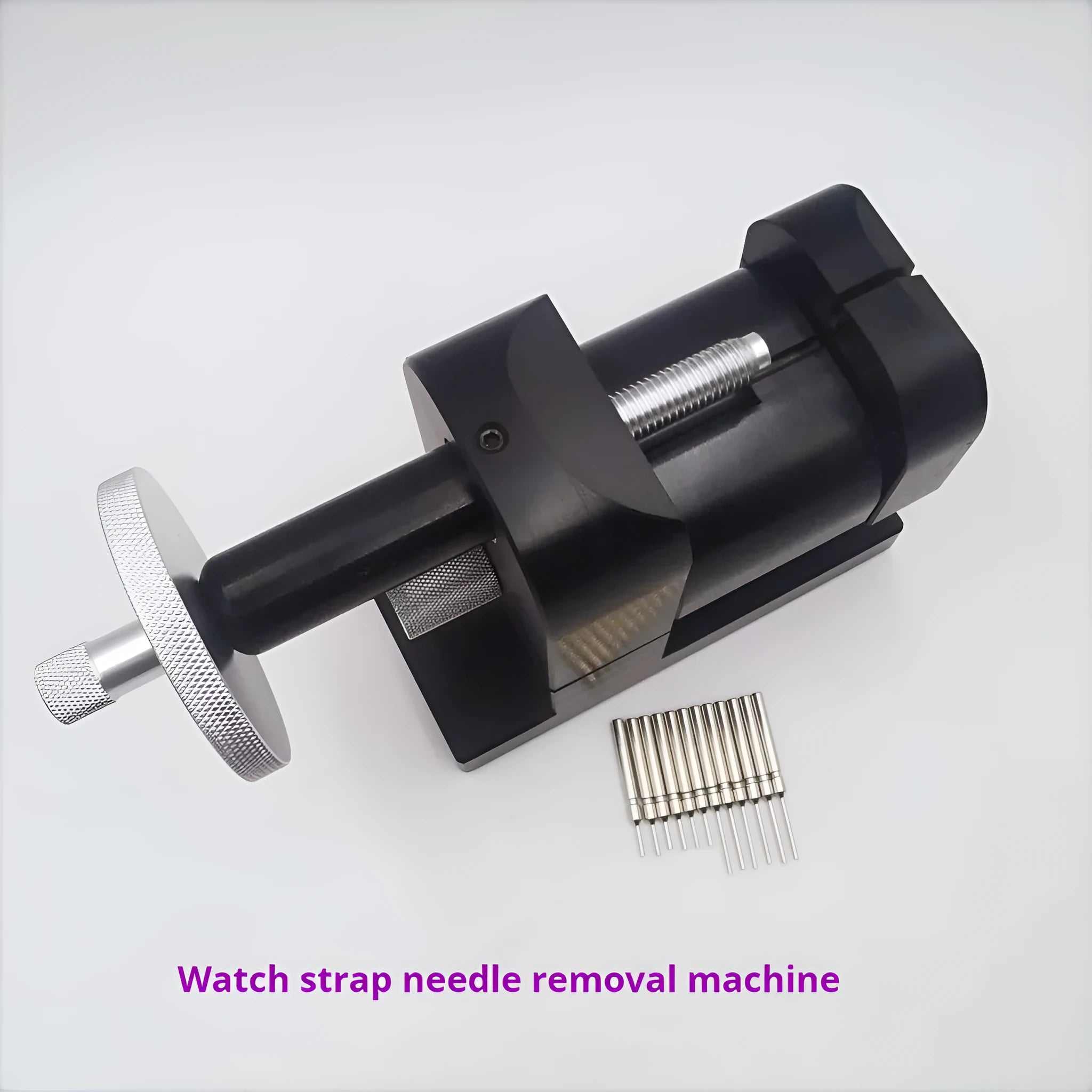 Alloy steel watch strap stripping machine tool set for watch repair on a workbench.
