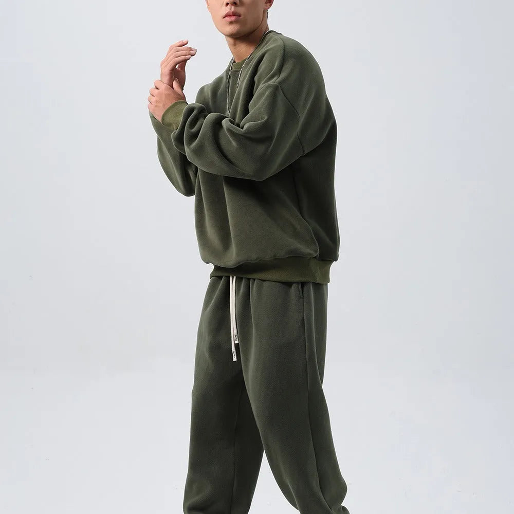 Men's polar fleece winter sports suit set showing crew neck coat and padded trousers in double-sided fleece fabric