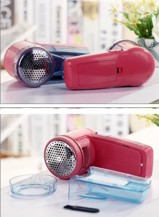 Portable electric clothing lint remover device on a sweater.