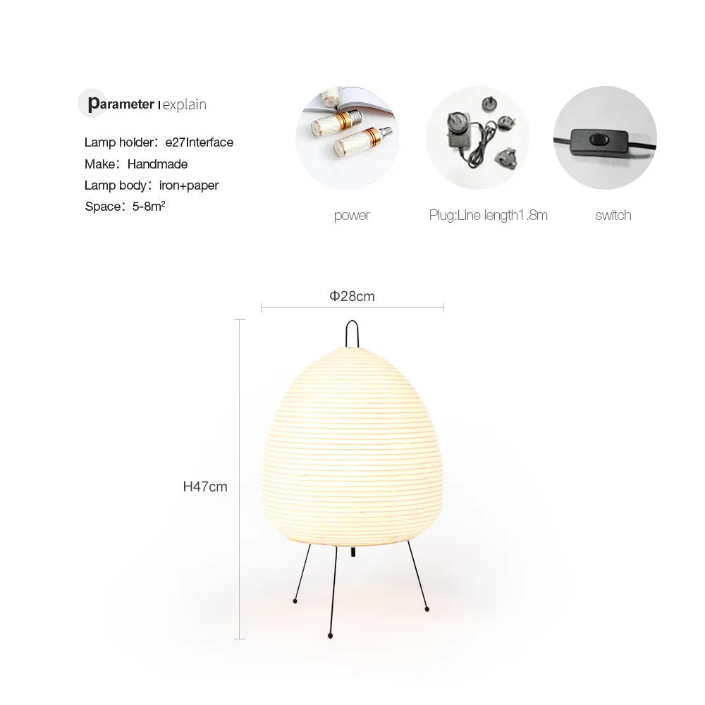 Japanese style table lamp with handmade paper shade and aluminium base on a wooden surface.