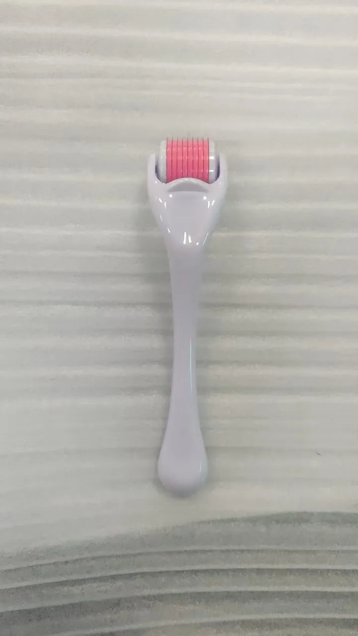 Black handle microneedle roller with purple wheel showing 540 needles, next to white and blue handle options.
