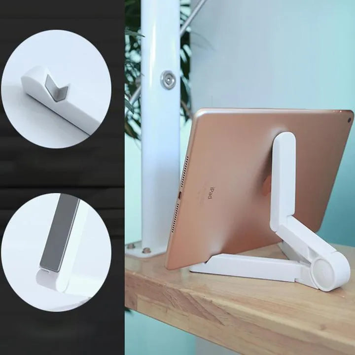 Black foldable tablet holder open in landscape mode holding a smartphone, showing its compact size and non-slip rubber surface.
