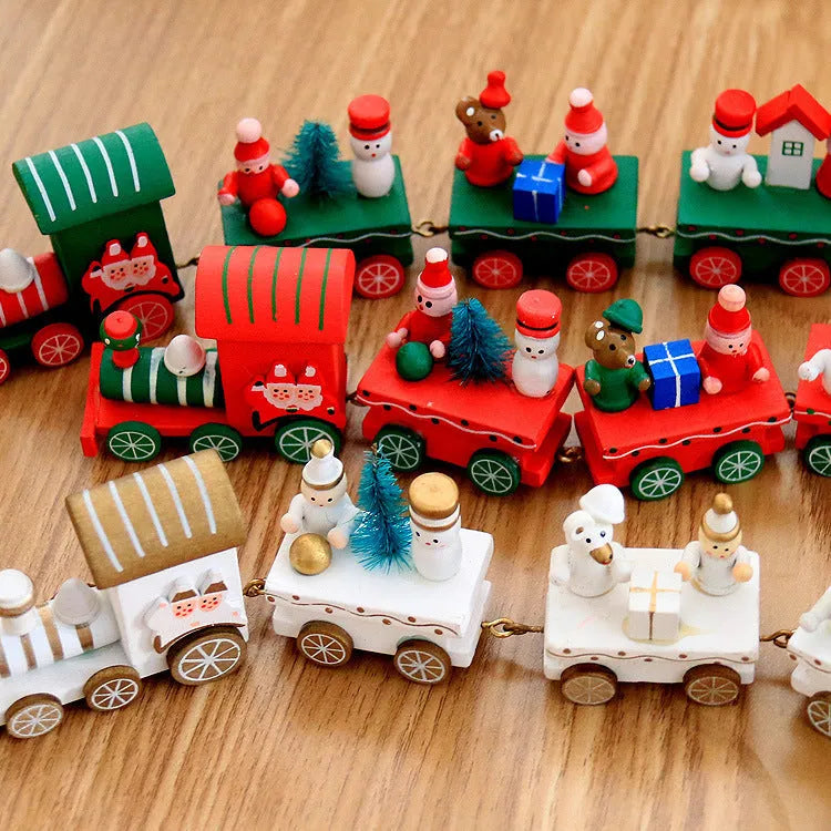 Four mini wood train cars in red, white, and green paint linked together on a shelf