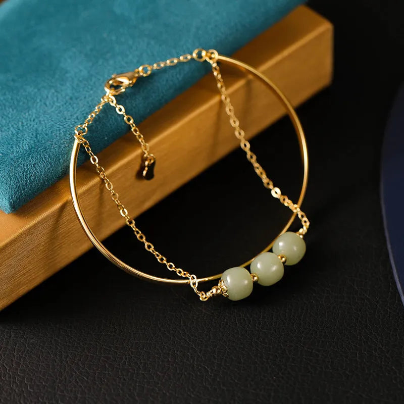 Hetian jade women's bracelet with gold inlay, showing lucky bead design in single, double, and three bead styles.