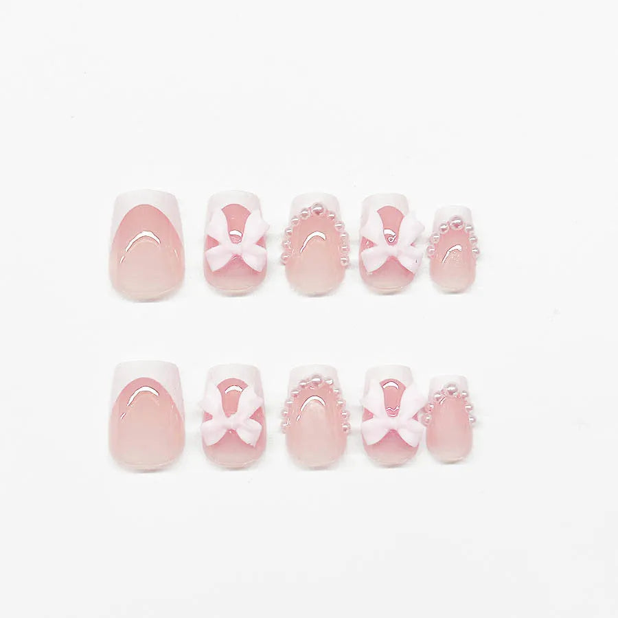 Artificial French manicure nail set with bow decorations and multiple patterns