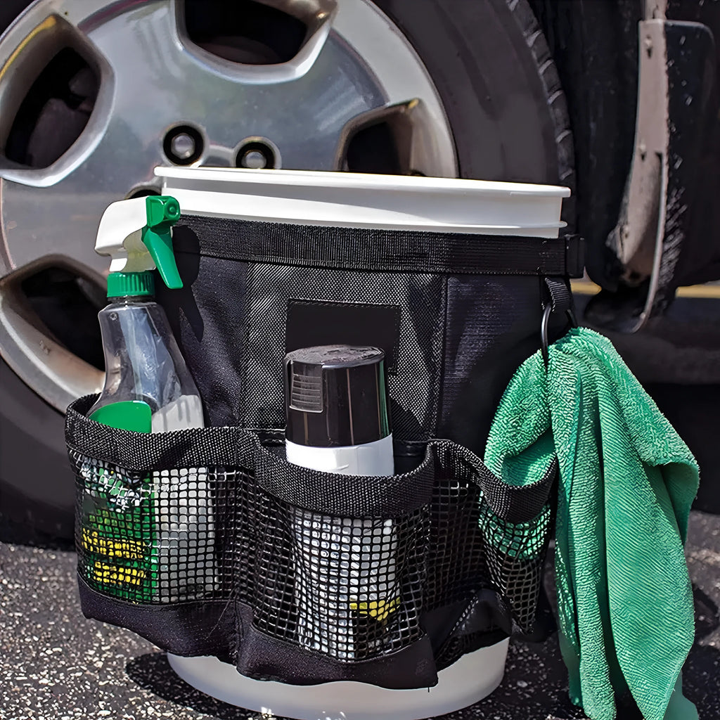 Black cylindrical polyester storage bag mounted on 5 gallon barrel with carry handles visible