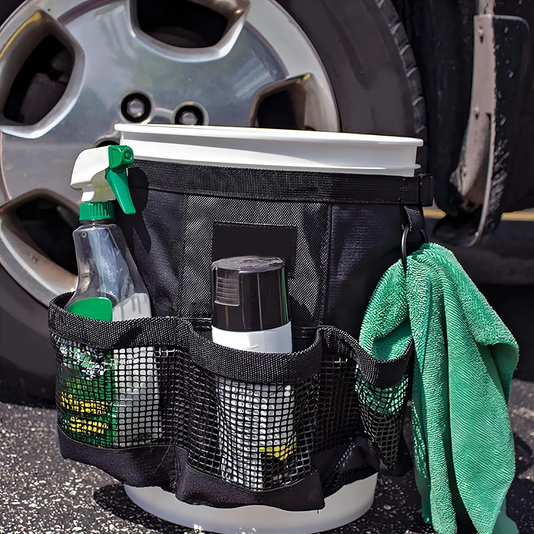Black cylindrical polyester storage bag mounted on 5 gallon barrel with carry handles visible