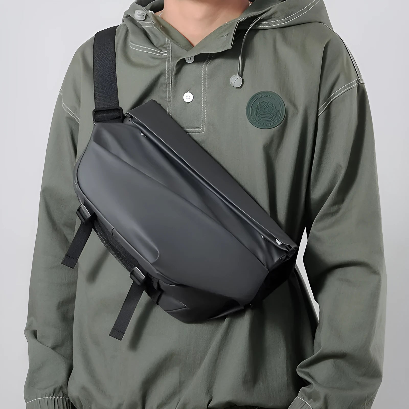 Grey medium-sized crossbody bag for men with shoulder strap and zipper opening
