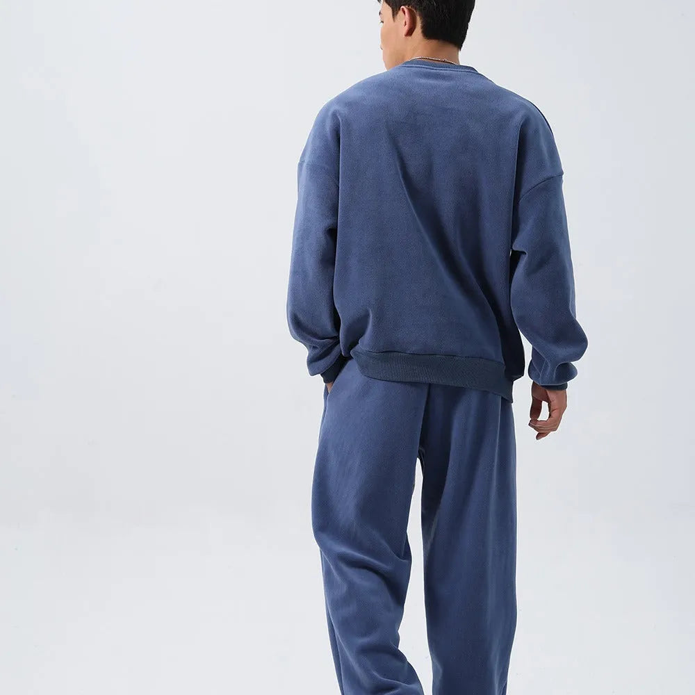 Men's polar fleece winter sports suit set showing crew neck coat and padded trousers in double-sided fleece fabric