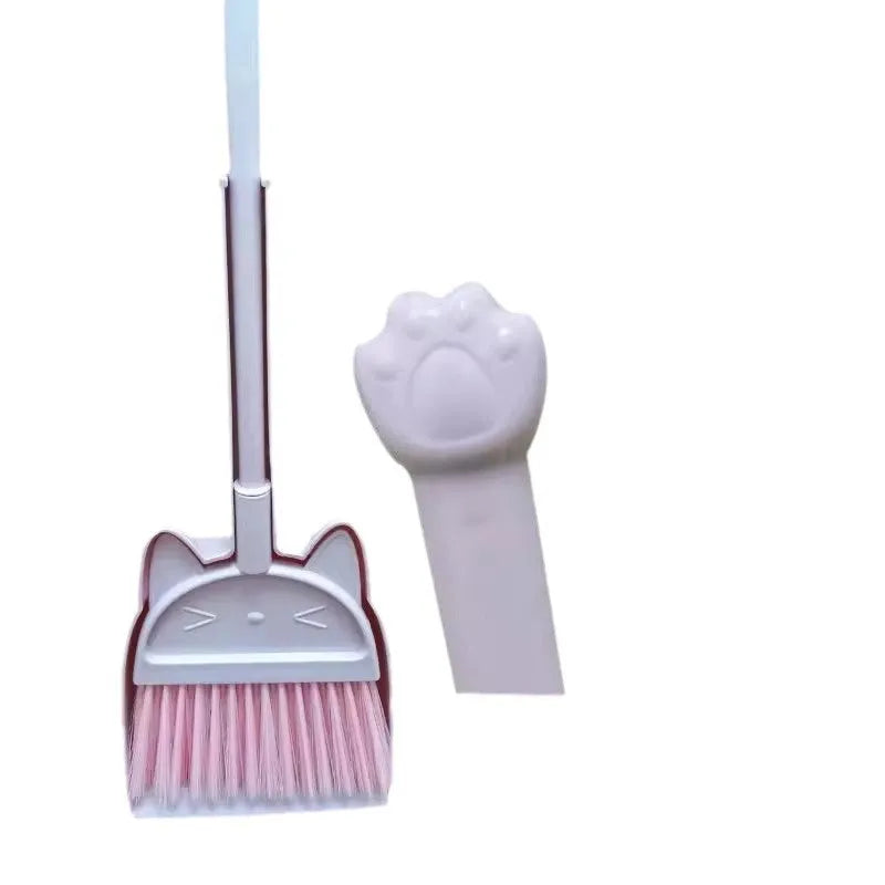 Green plastic broom and dustpan set showing the broom's rotating head and long bristles.