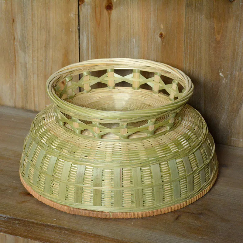 Handmade woven bamboo storage basket in natural colour showing three size variations