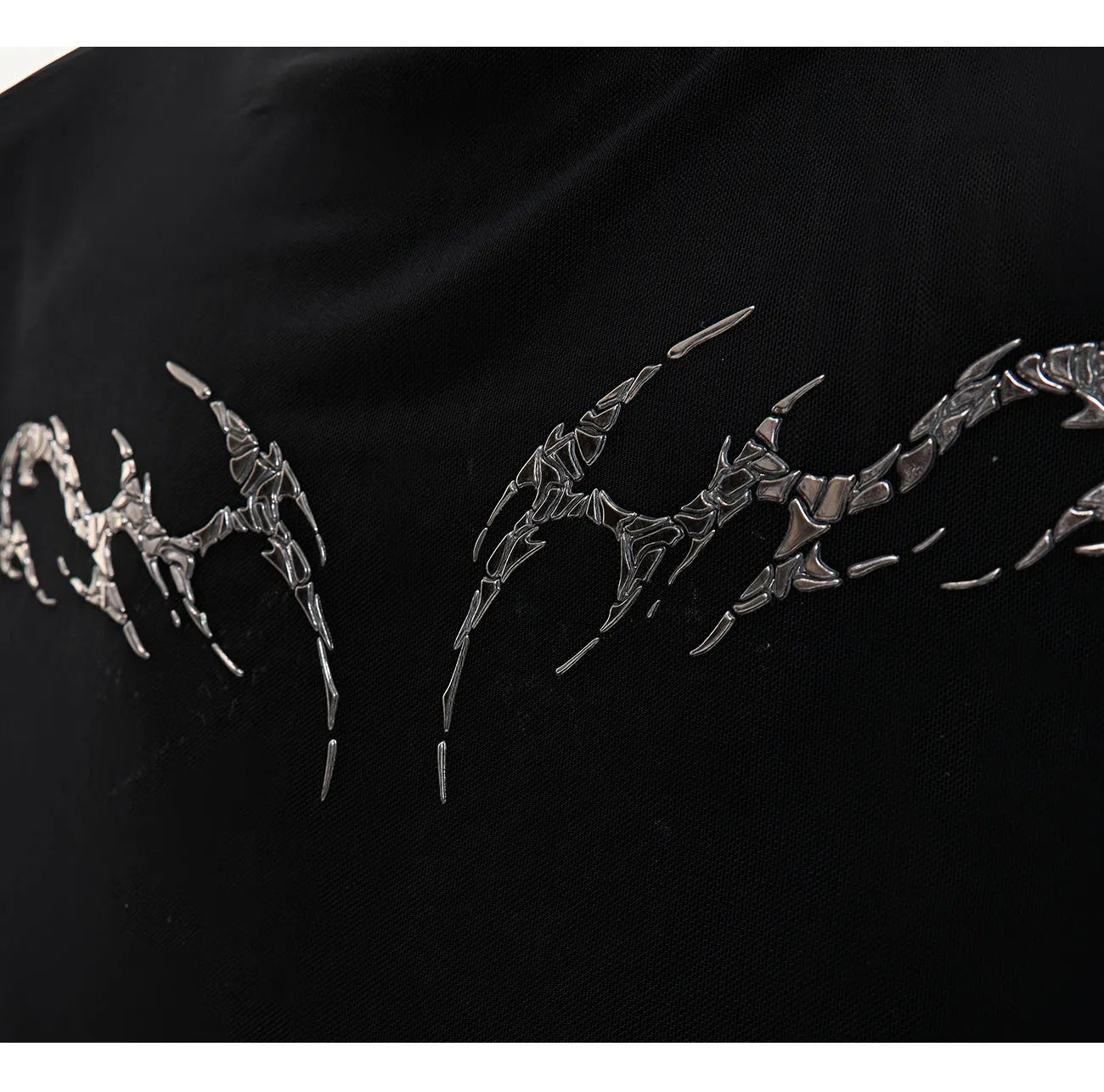 Slim fit long sleeve mesh shirt in black on a hanger, showing its lightweight texture and modern cut.