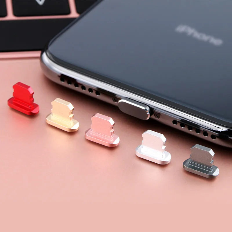 Aluminium alloy dust plug for iPhone charging port in gold, silver, blue, red, grey, black, and rose gold colours.