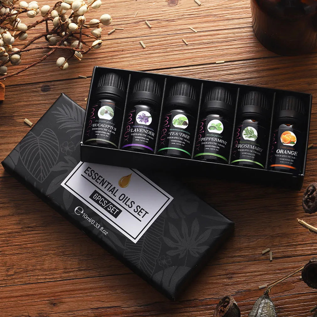 Six 10ml essential oil bottles in a row – tea tree, mint, sweet orange, eucalyptus, rosemary, lavender