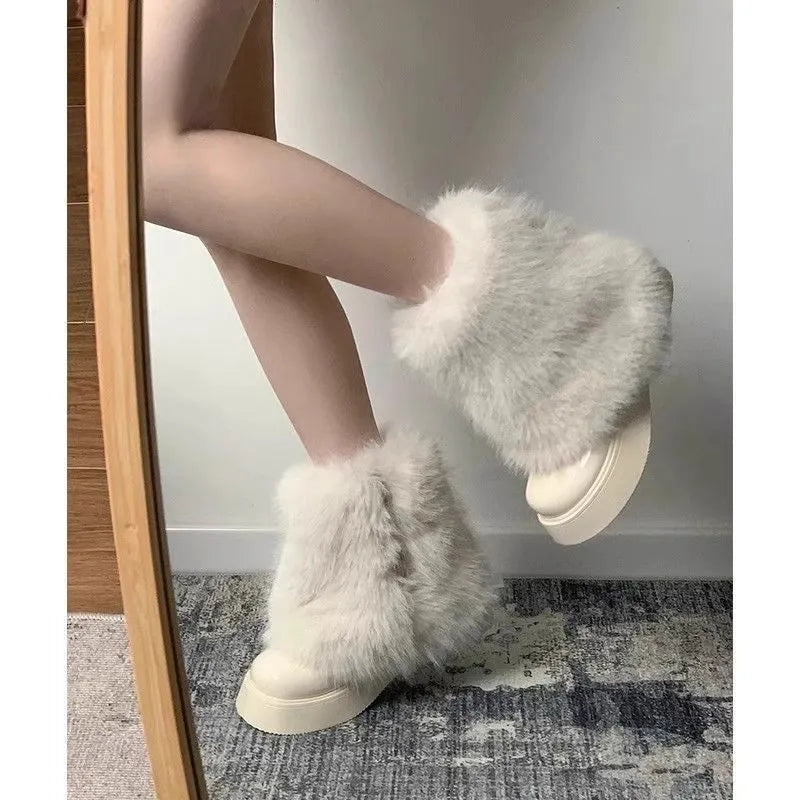 Women's black fleece-lined snow boots with waterproof rubber platform sole