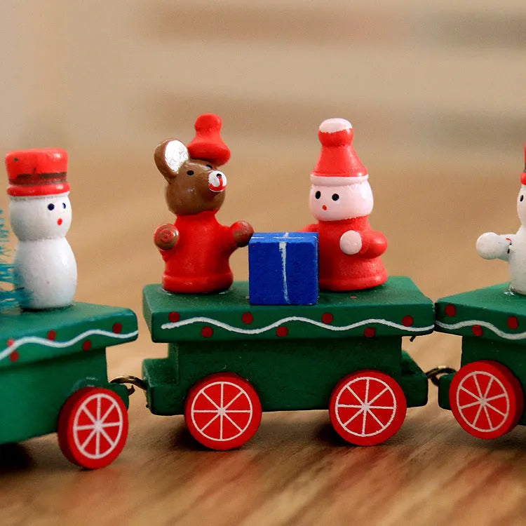 Four mini wood train cars in red, white, and green paint linked together on a shelf