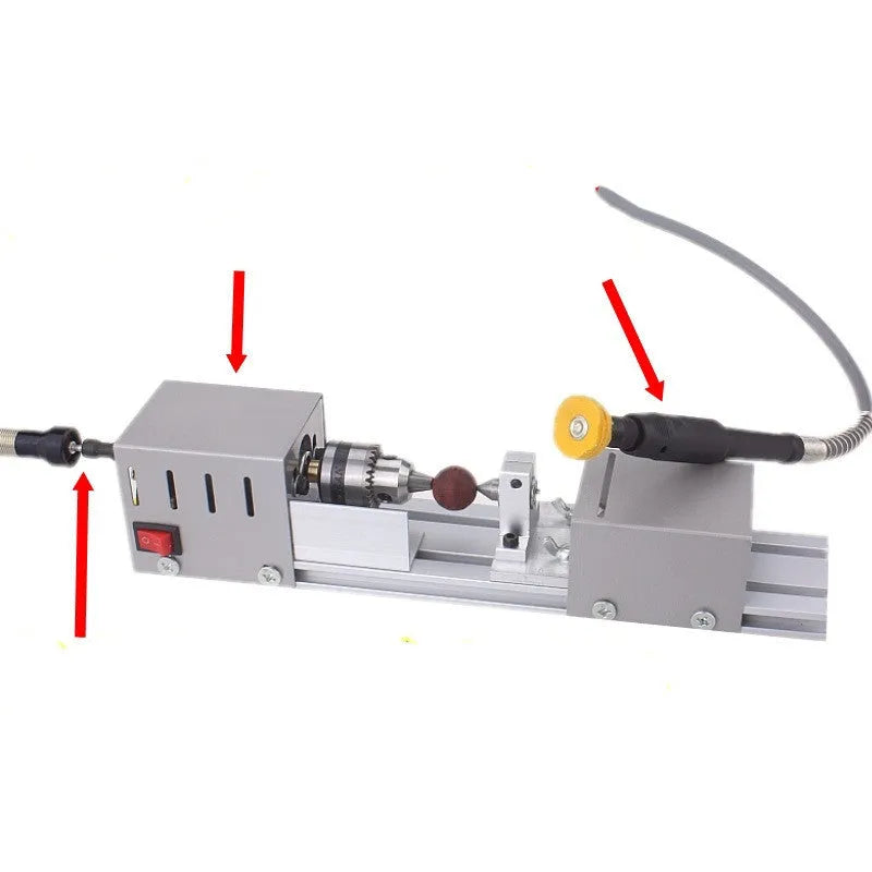 Silver mini woodworking lathe metal model with carving tools and 140mm capacity on workbench