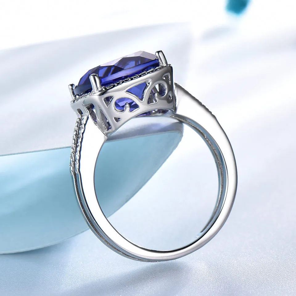 Women's sterling silver ring with blue tanzanite stone showing band detail