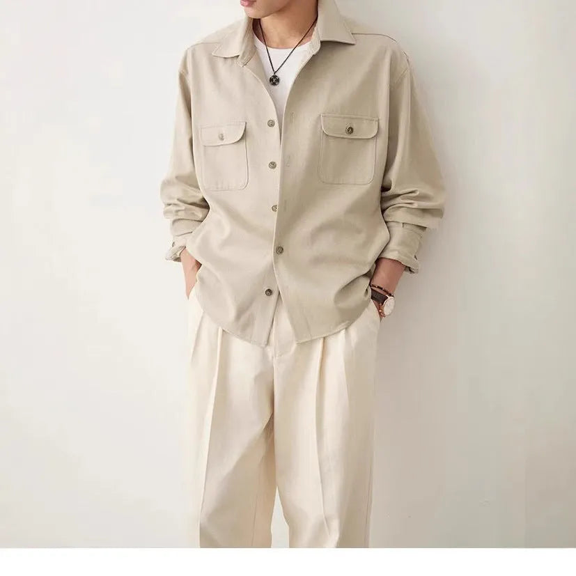 Men's light sand rice coloured long sleeve shirt with a simple lapel, laid flat.