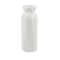 Green melamine drop-resistant vase with a wide base on a wooden table