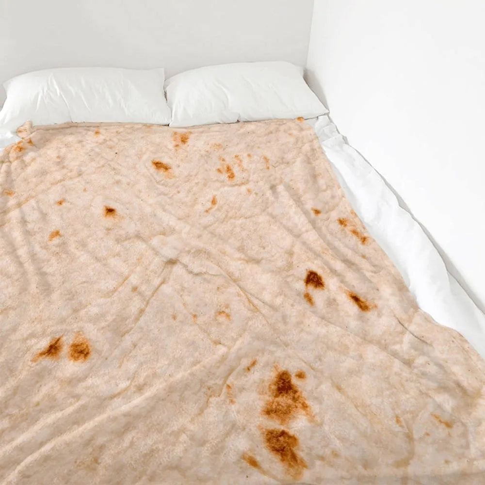 Round flannel burrito blanket with food-themed printing, shown in coral fleece fabric.
