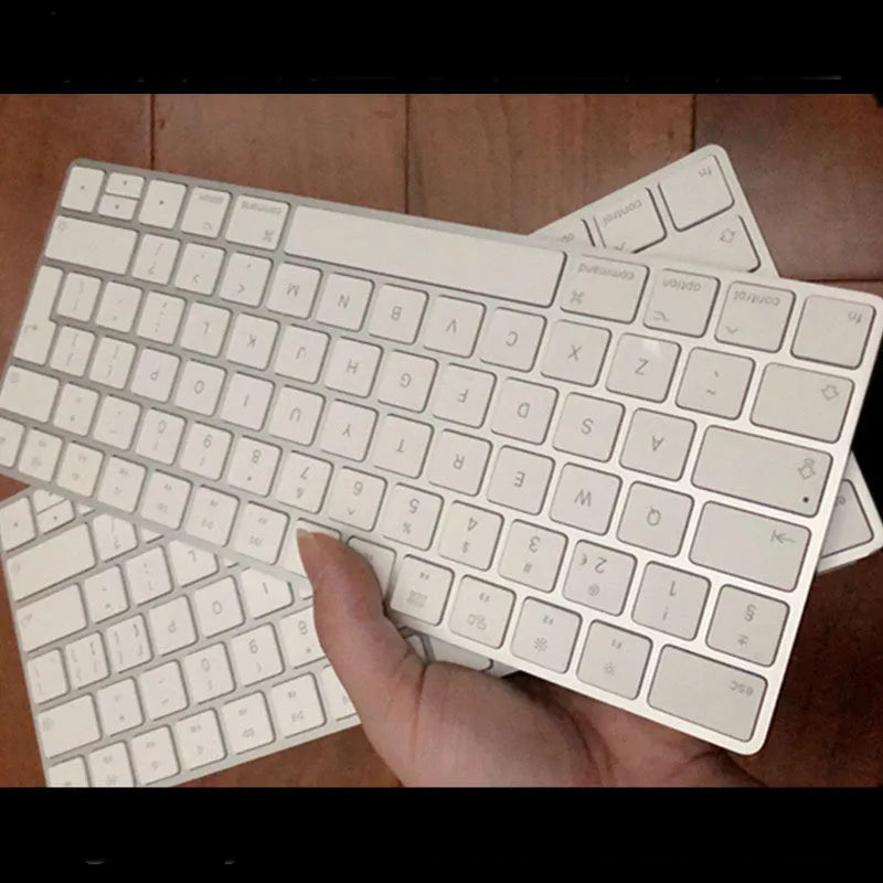 White Apple Bluetooth wireless keyboard with ultra-thin metal construction and multimedia keys