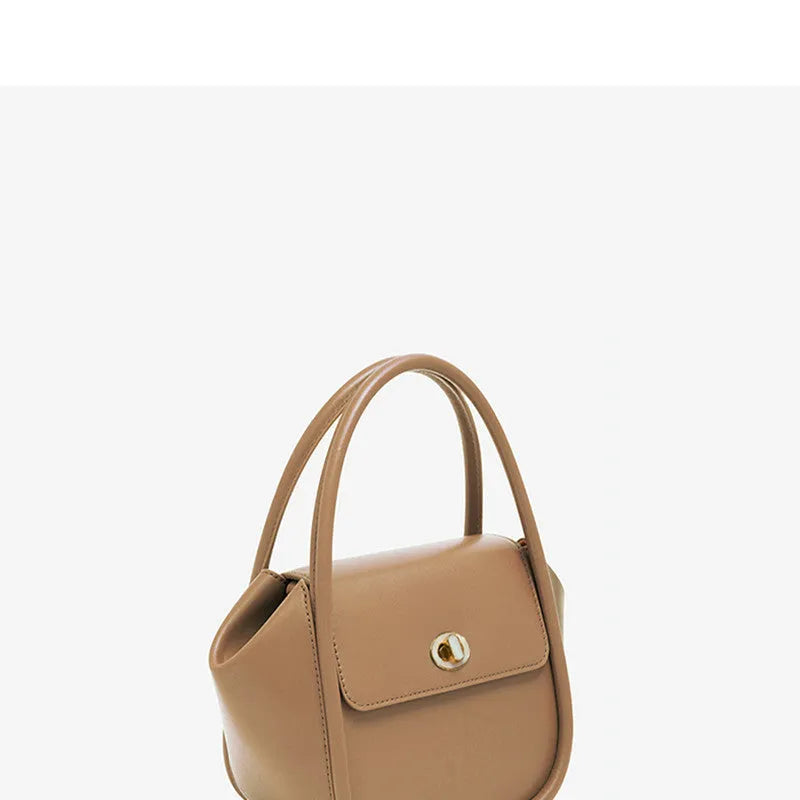 Genuine cow leather wing-shaped tote bag with buckle detail and cross-body shoulder strap