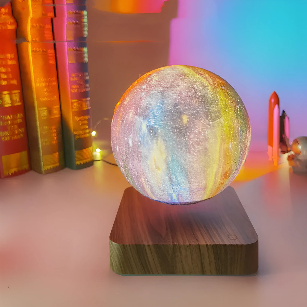 Magnetic levitation galaxy moon lamp floating above walnut-coloured circular base with colourful star details