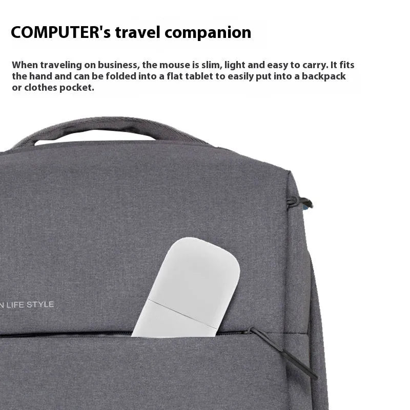 Folded Bluetooth wireless mouse showing compact 131.2mm length with touch-sensitive surface