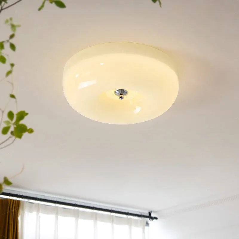 Cream coloured American style bedroom ceiling lamp with a modern vintage design shown in a bedroom setting.
