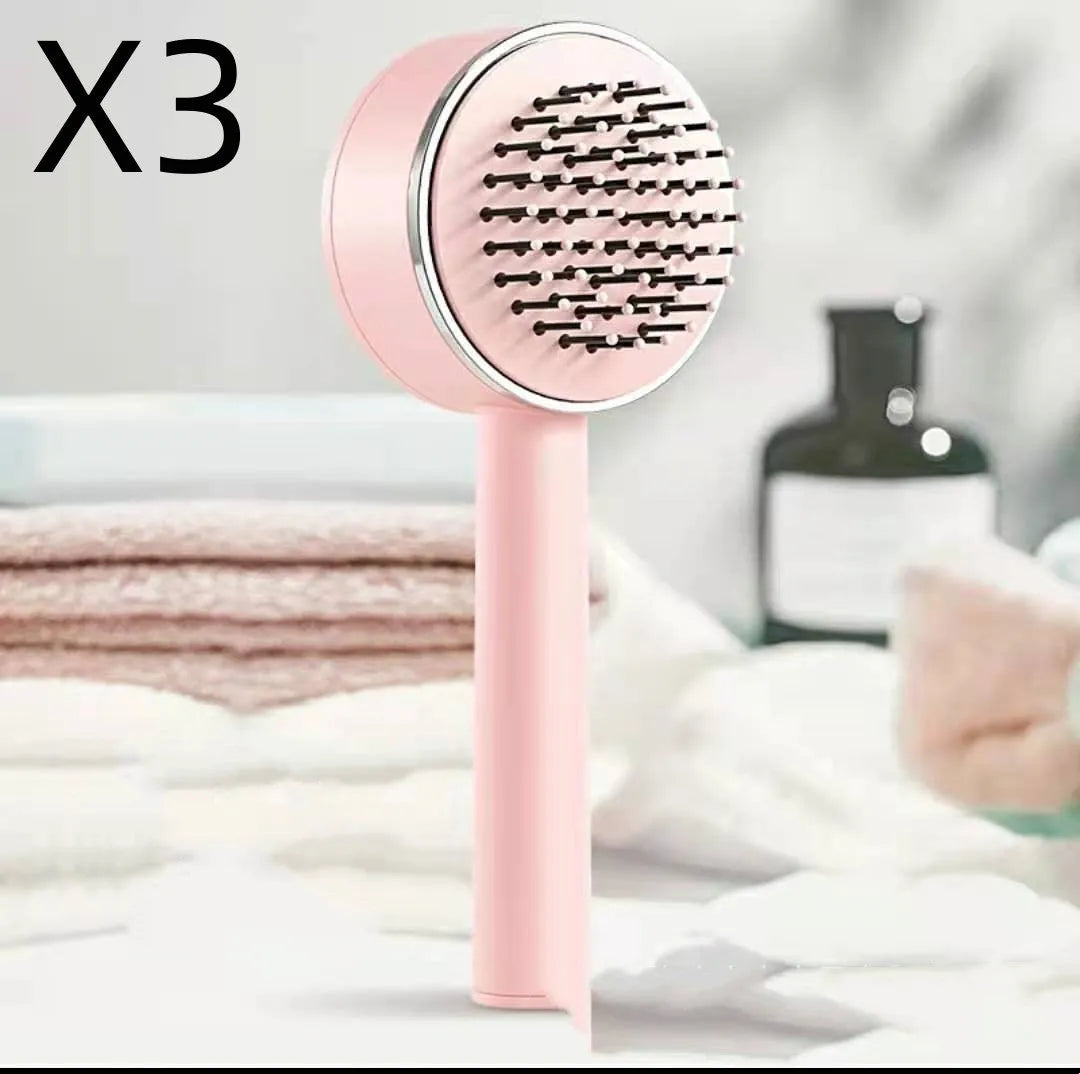 Plastic air cushion comb with long handle in white, green, and pink colours for hair detangling and styling