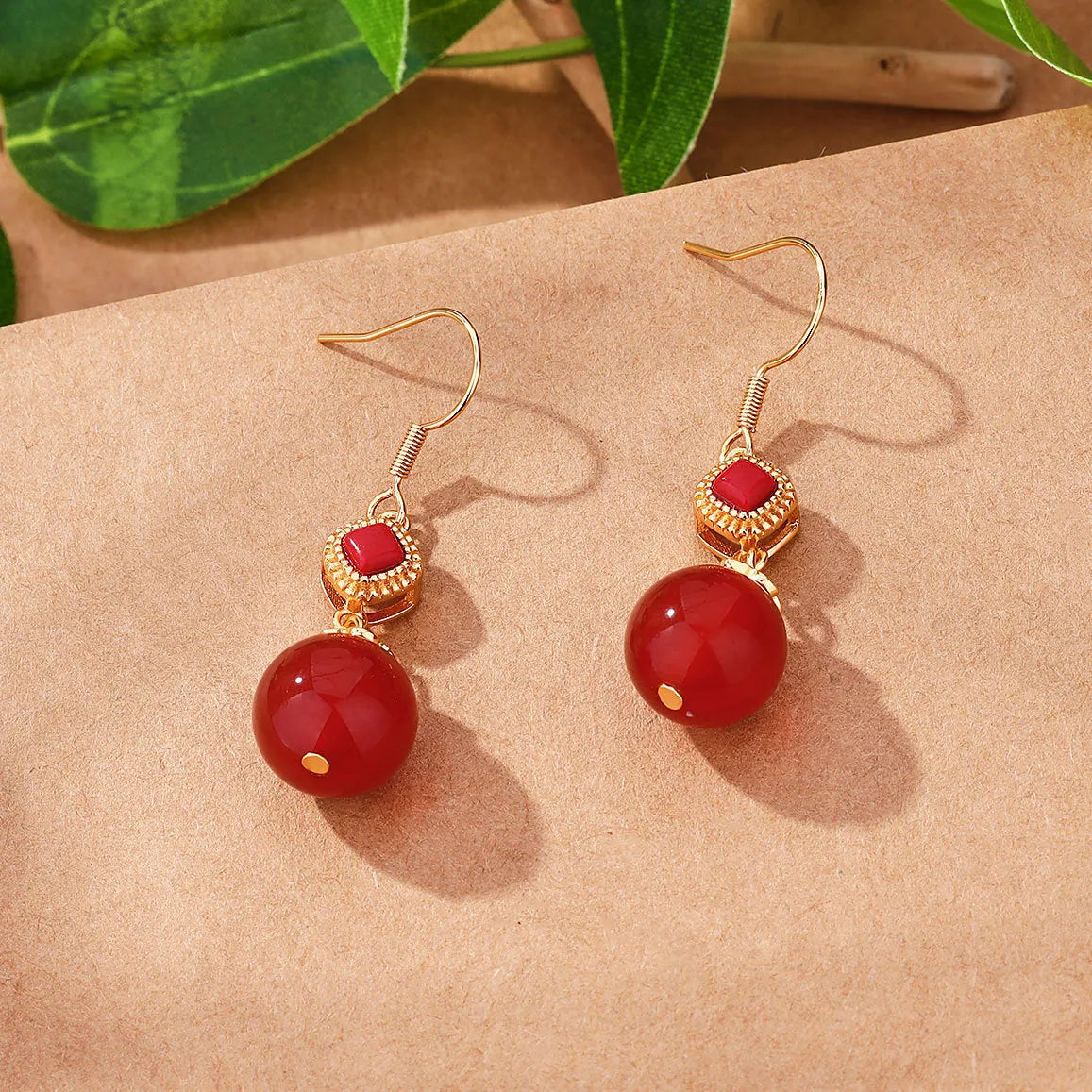 Geometric copper alloy earrings with round Southern red agate beads set in S925 silver.