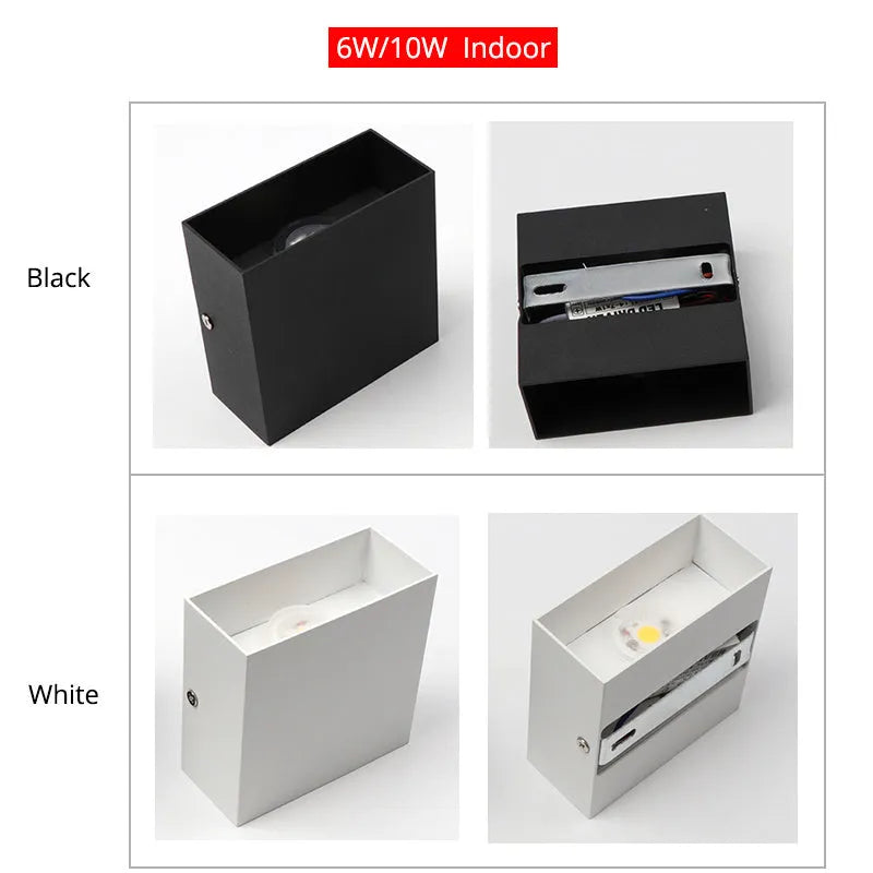 Small square aluminium wall lamp in black, mounted on a corridor wall, emitting a warm white light.