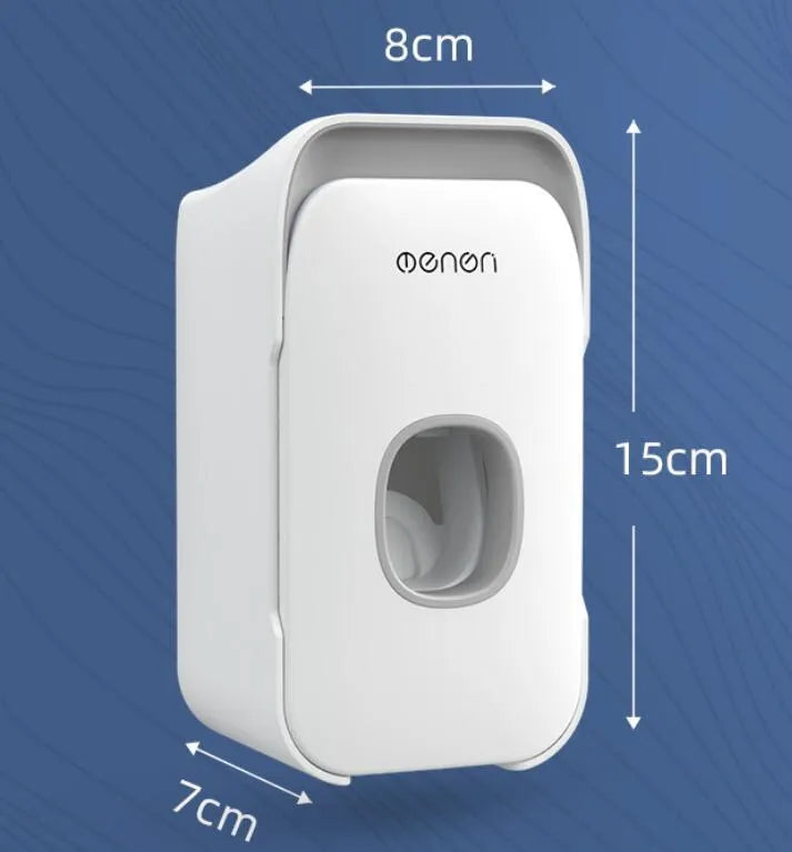 Automatic wall-mounted toothpaste dispenser in blue colour on a bathroom wall.