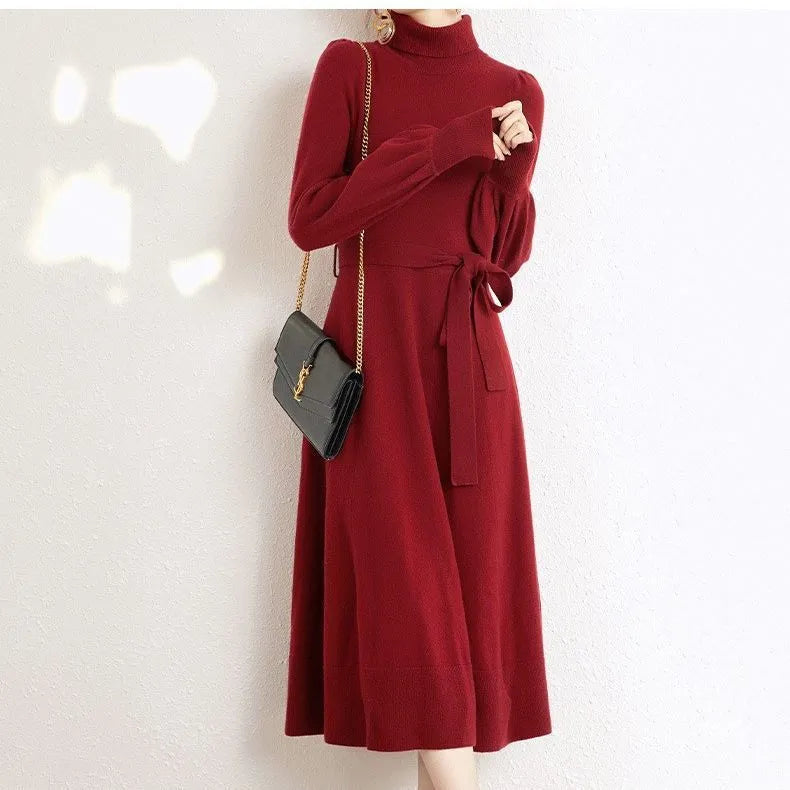 Rose red loose fit turtleneck knitted dress with long sleeves and a midi-length skirt.