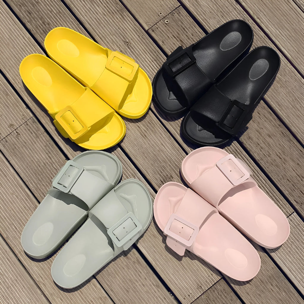 Women's grey blue flip-flop sandals with an adjustable buckle on the strap and a soft EVA sole.