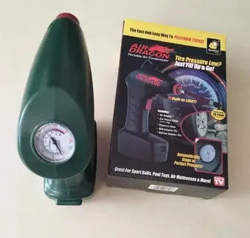 Portable 12V car tyre electric pump with digital gauge and hose on a grey background.