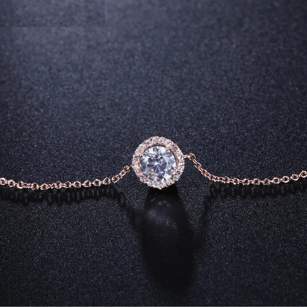 Round crystal anklet on ankle, rose gold tone with alloy and silver or gold plating, 22cm chain plus 4cm extender
